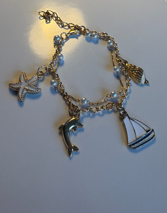 Bracelet dorée Thème Marin - Étoile de Mer, Dauphin et Voilier